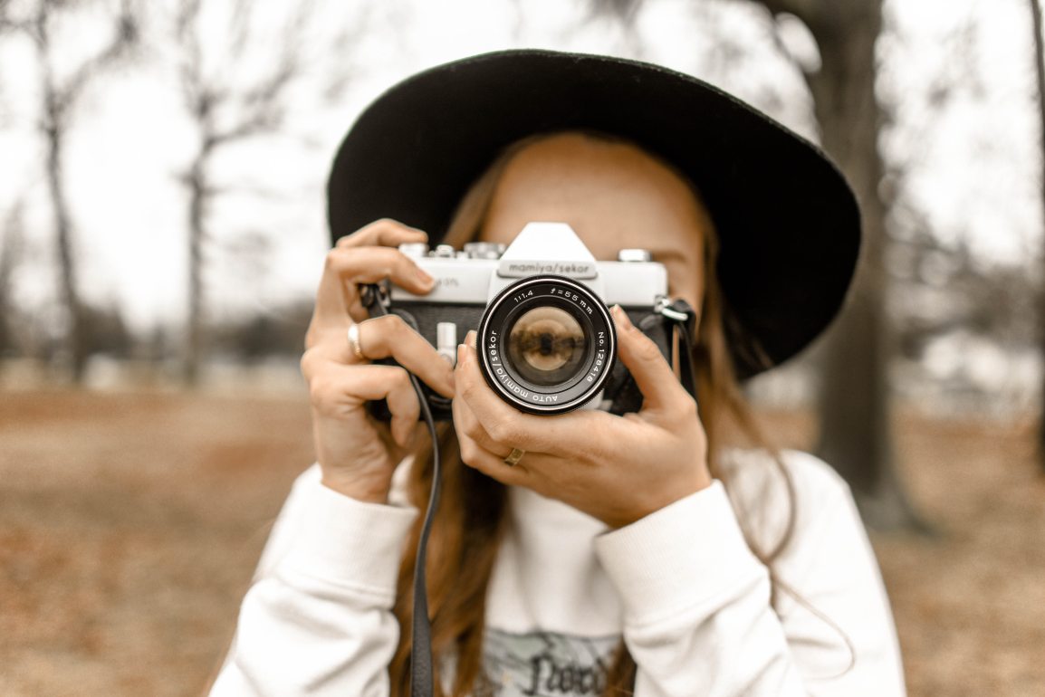 girl-with-vintage-camera-at-antique-market